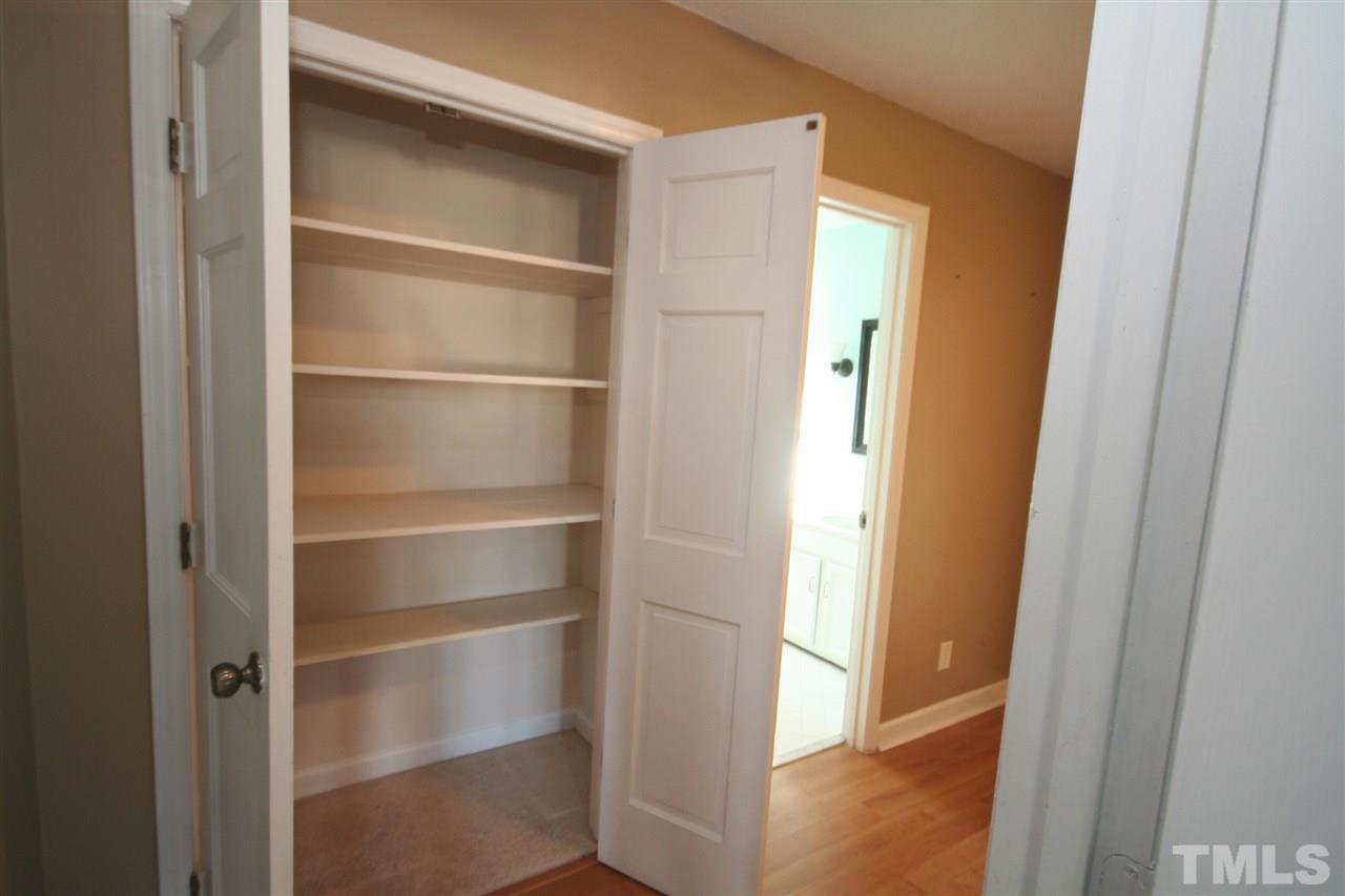 5821 Morning Forest Drive Raleigh, NC 27609 - Photo 20 of 25 a view of walk in closet with empty racks