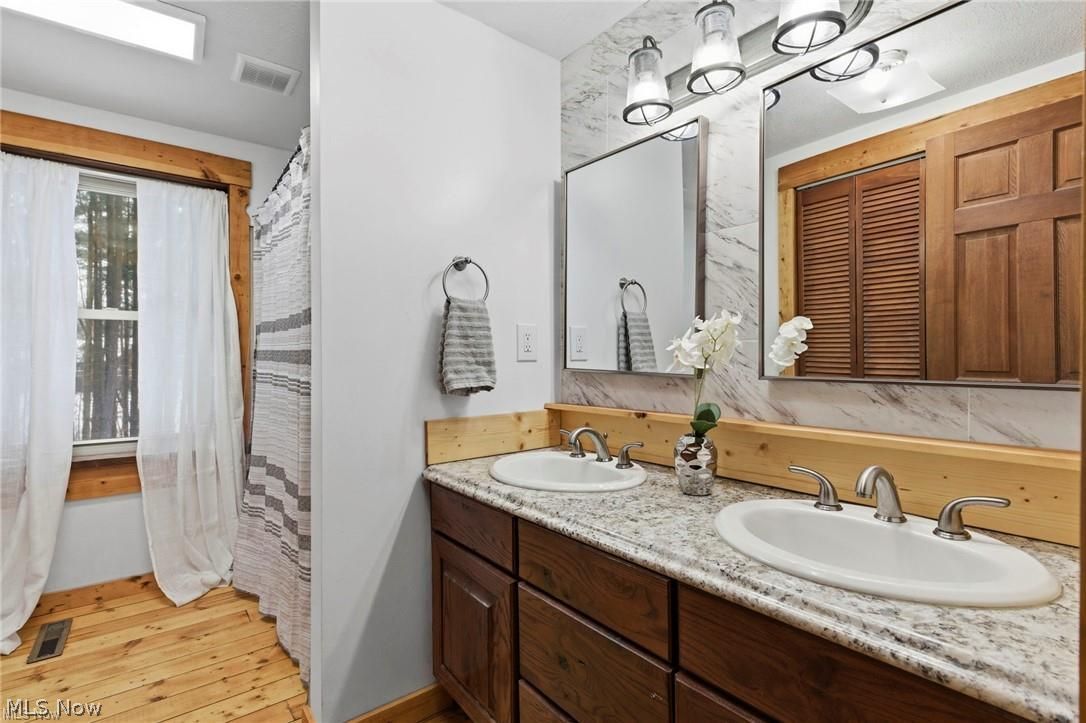 5352 Lance Road Medina, OH 44256 - Photo 27 of 43 Full bath featuring double vanity and light wood finished floors