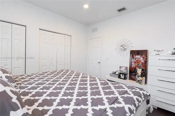 a bedroom with furniture and a window