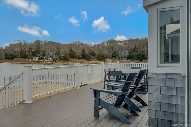 a view of a chairs and table in the balcony
