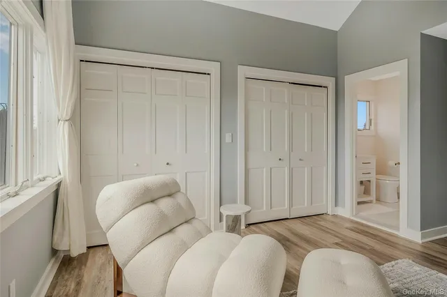 a bedroom with bed and a window