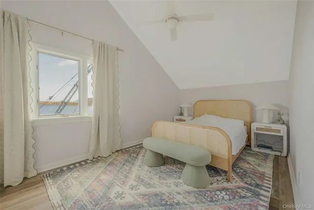 a bedroom with a bed and mirror