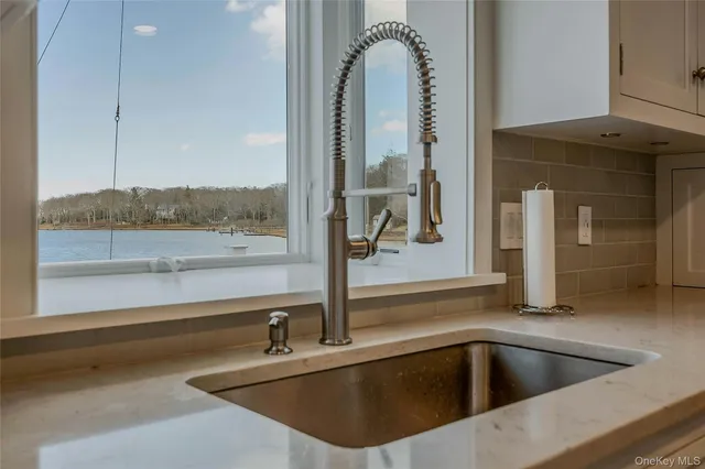 a kitchen with a sink and a window