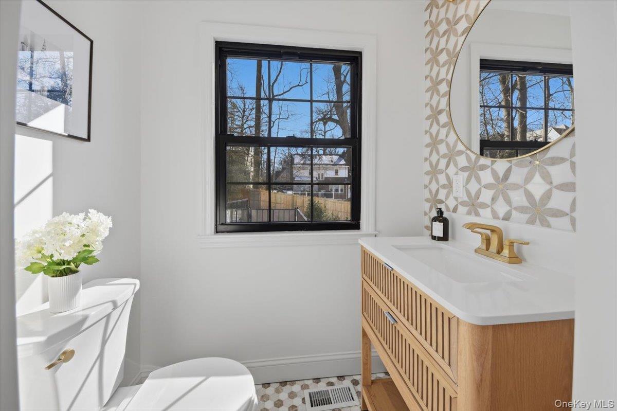 18 Lakeside Drive New Rochelle, NY 10801 - Photo 14 of 43 a bathroom with a sink toilet and window