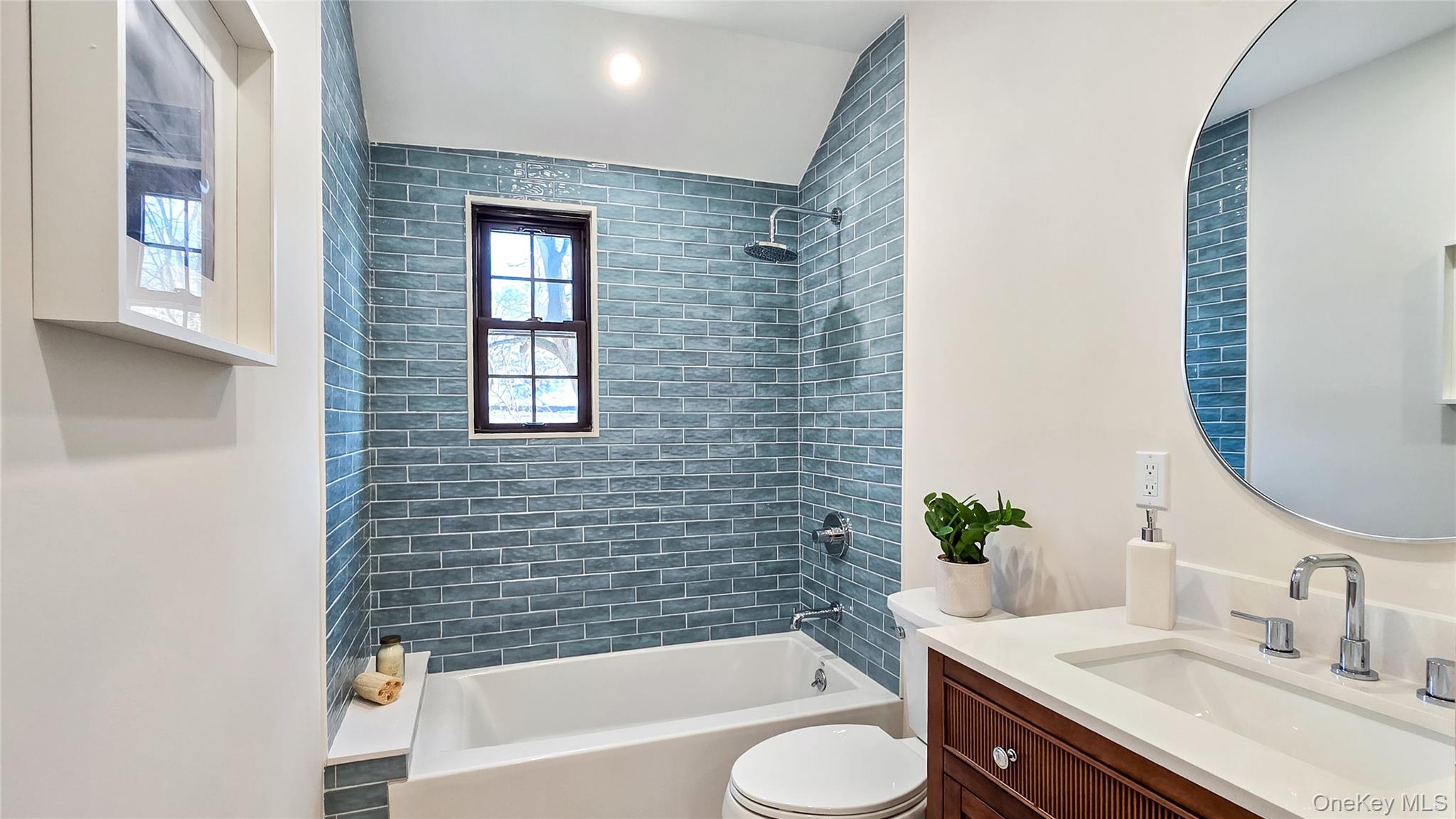 18 Lakeside Drive New Rochelle, NY 10801 - Photo 27 of 43 a bathroom with a granite countertop sink toilet and bathtub