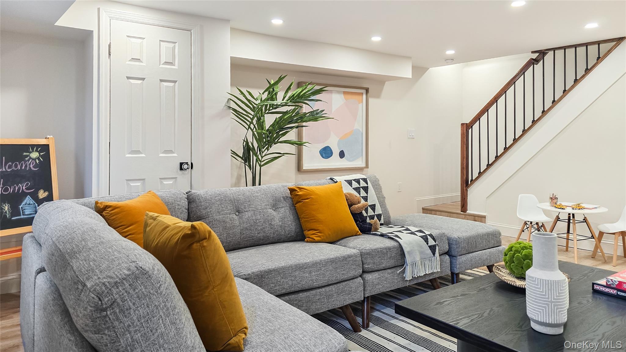18 Lakeside Drive New Rochelle, NY 10801 - Photo 31 of 43 a living room with furniture and a potted plant