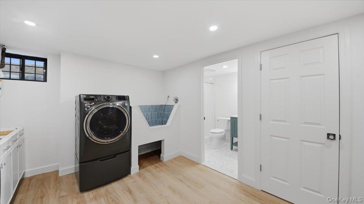 18 Lakeside Drive New Rochelle, NY 10801 - Photo 34 of 43 a view of a hallway with washer and dryer
