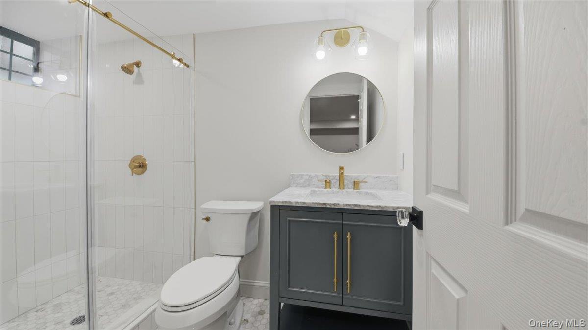 18 Lakeside Drive New Rochelle, NY 10801 - Photo 35 of 43 a bathroom with a granite countertop toilet sink and mirror