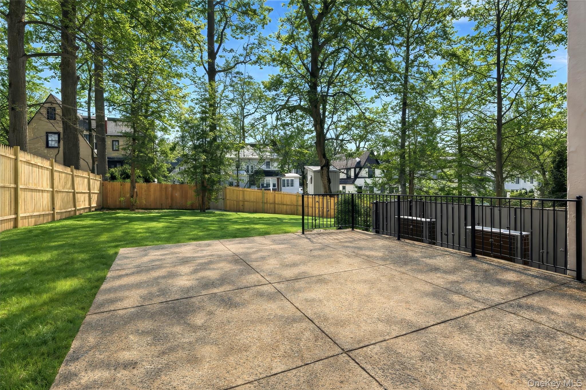 18 Lakeside Drive New Rochelle, NY 10801 - Photo 36 of 43 a view of a backyard with green space