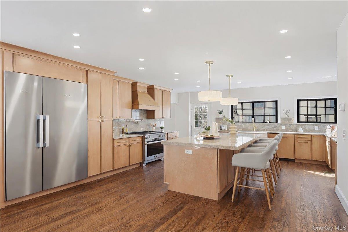 18 Lakeside Drive New Rochelle, NY 10801 - Photo 10 of 43 a kitchen with refrigerator a stove and chairs