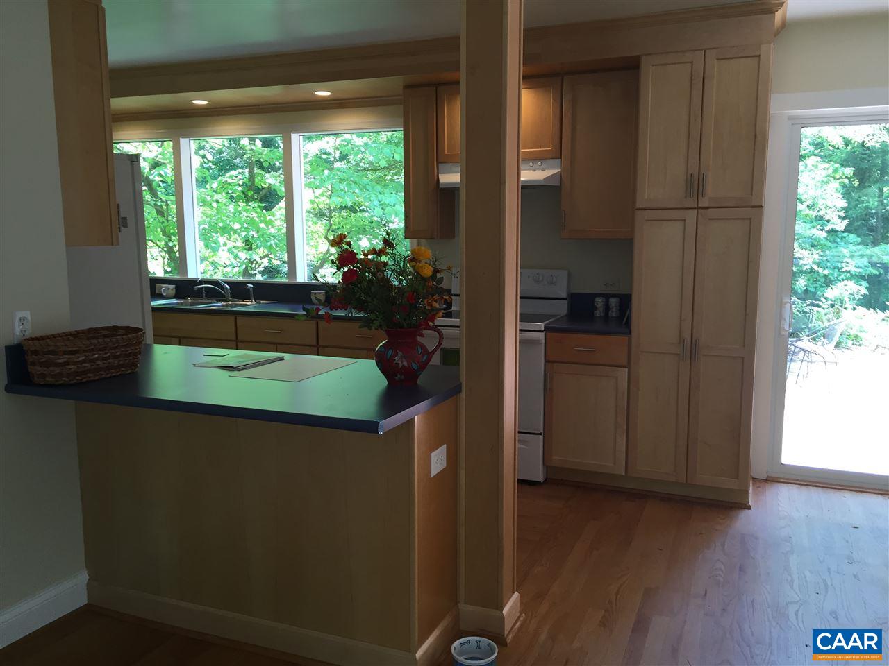 1531 Rugby Road Charlottesville, VA 22903 - Photo 6 of 49 a kitchen with a window and wooden floor