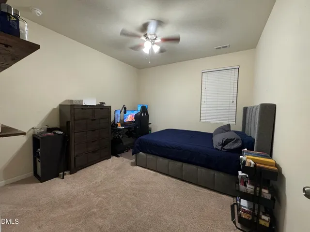 a kitchen with stainless steel appliances granite countertop a stove and a refrigerator