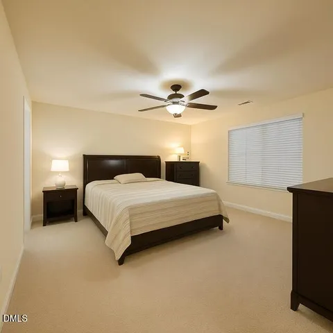 a bedroom with a bed and furniture