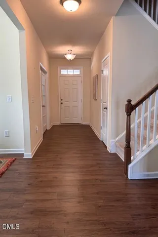 a bedroom with a bed and a ceiling fan