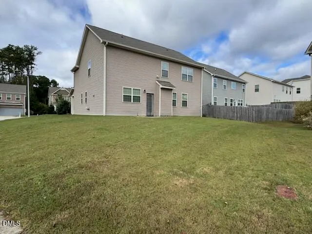 a big house with a big yard and large trees