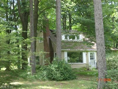 5386 SOM Center Road Solon, OH 44139 - Photo 1 of 1 Charming cottage nestled in the woods, back yard adjoins 14 acres or nature preserve.
