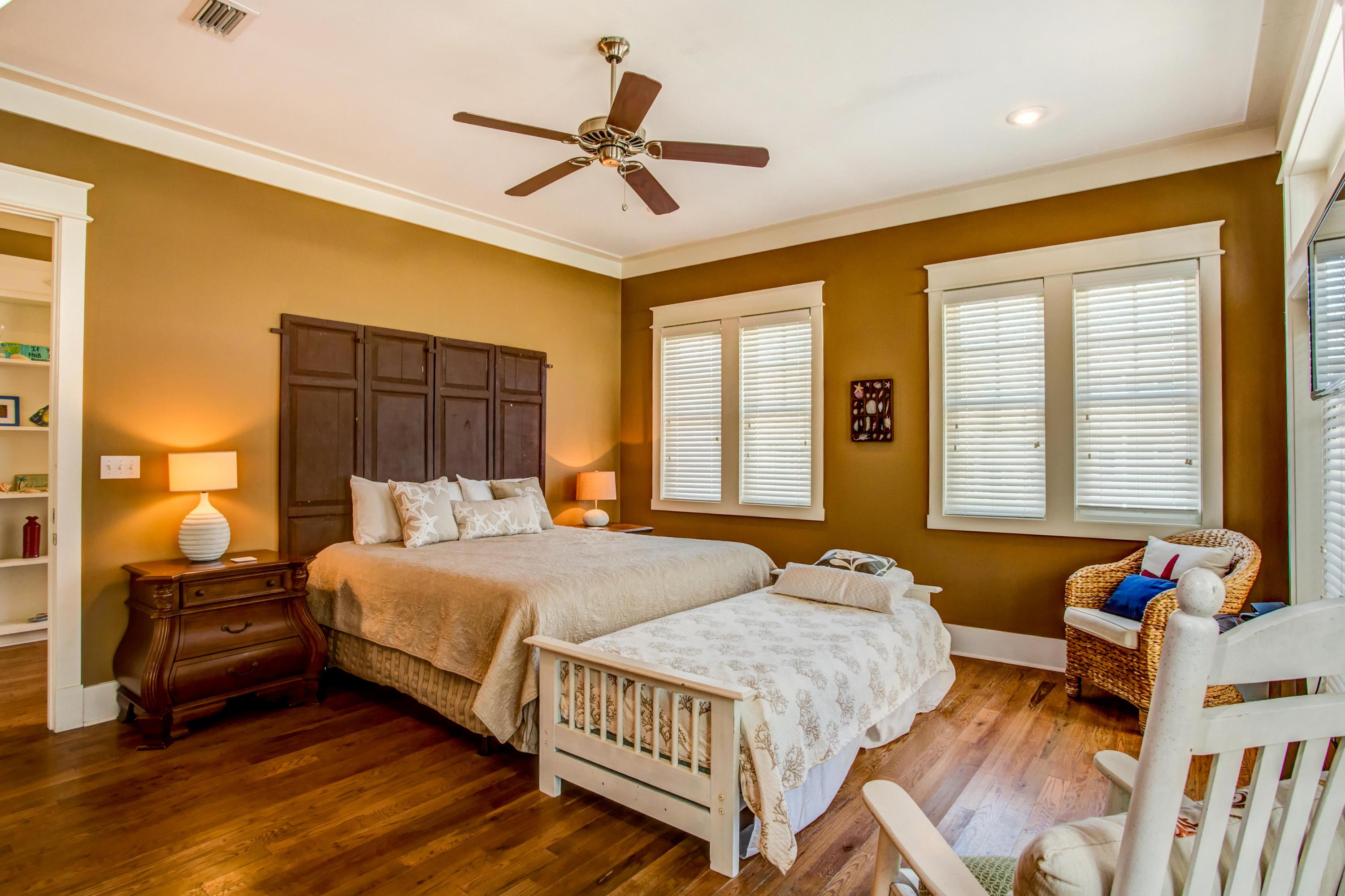 80 Chelsea Loop Road Santa Rosa Beach, FL 32459 - Photo 20 of 43 a bedroom with a bed and wooden floor