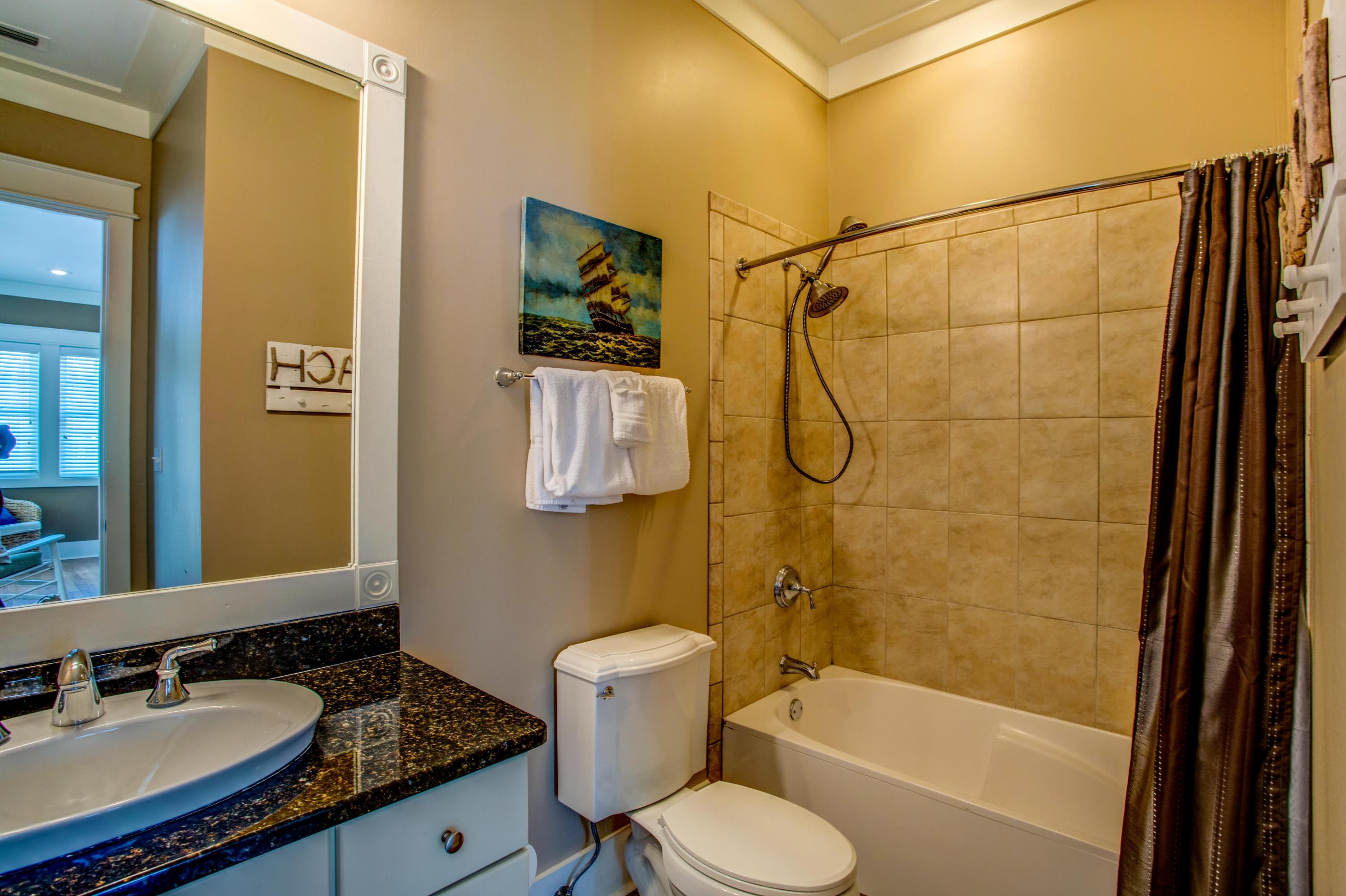 80 Chelsea Loop Road Santa Rosa Beach, FL 32459 - Photo 21 of 43 a bathroom with a granite countertop sink toilet and shower