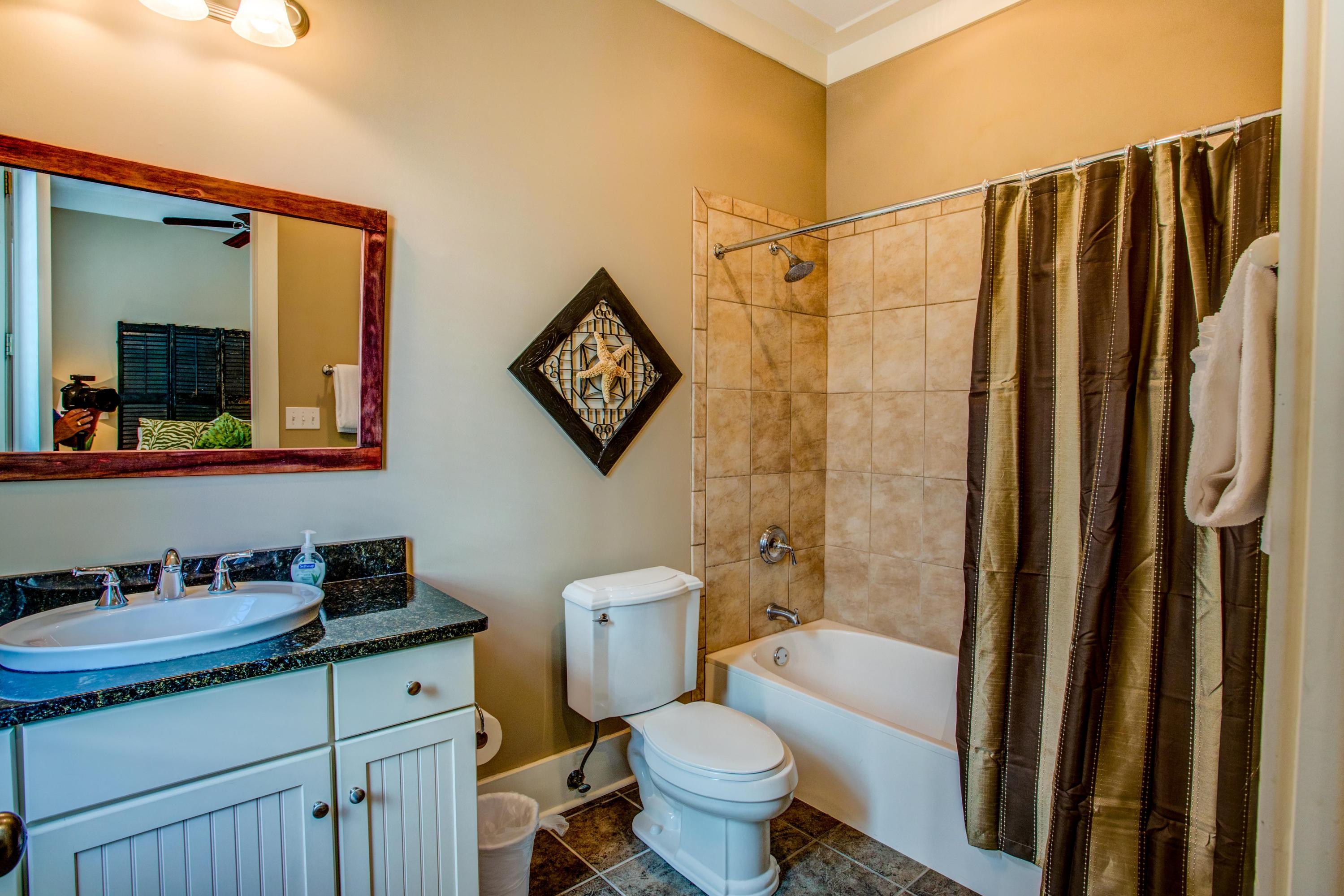 80 Chelsea Loop Road Santa Rosa Beach, FL 32459 - Photo 25 of 43 a bathroom with a granite countertop sink toilet and shower