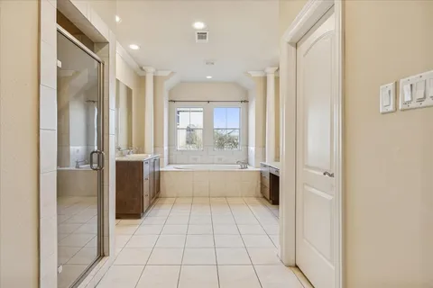 a bathroom with a bathtub and a shower