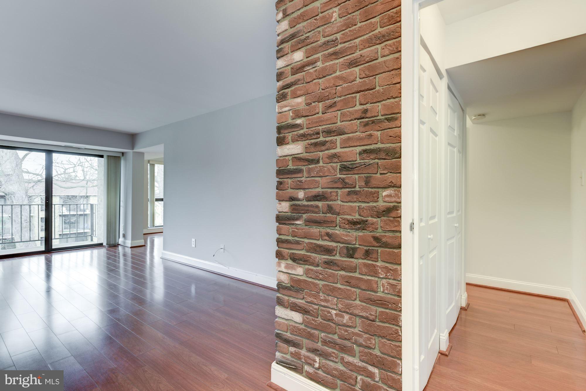 2018 Colts Neck Road, Unit 22 Reston, VA 20191 - Photo 3 of 26 Living Room with beautiful flooring, and brick.
