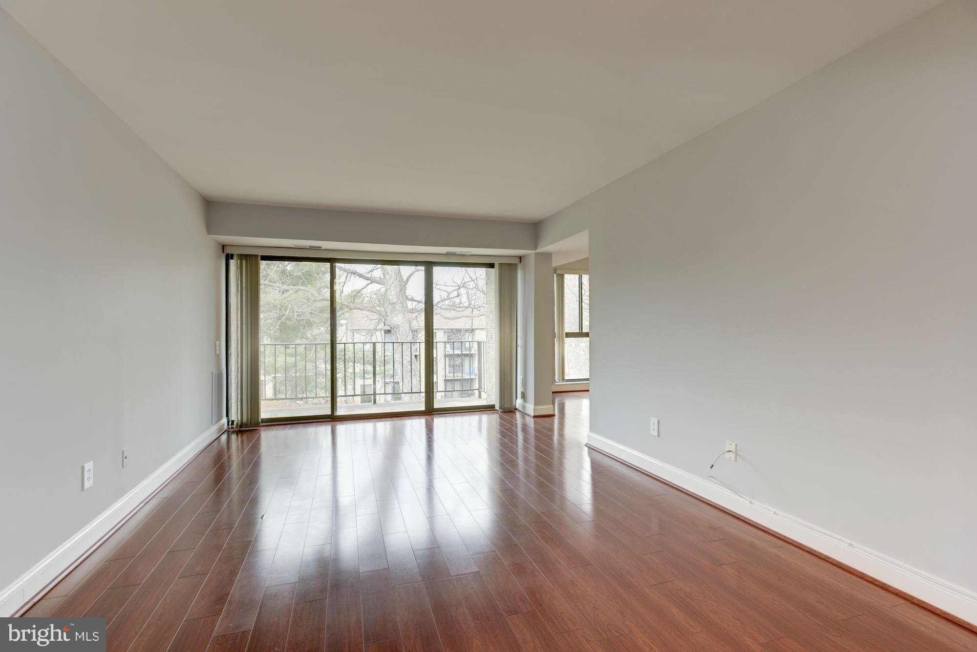 2018 Colts Neck Road, Unit 22 Reston, VA 20191 - Photo 4 of 26 Large Living Room opens to lovely balcony.