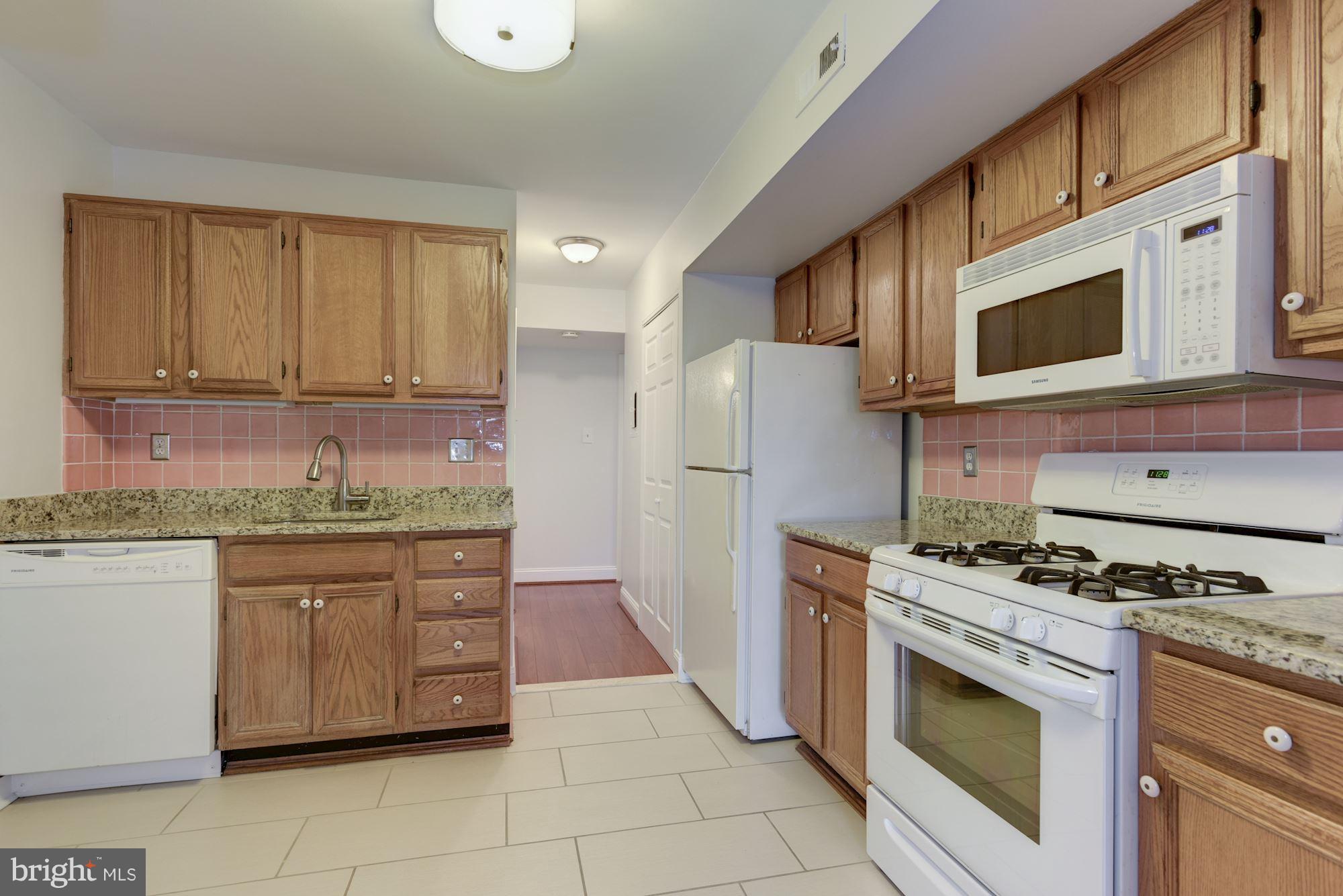 2018 Colts Neck Road, Unit 22 Reston, VA 20191 - Photo 9 of 26 Updated Kitchen with gas stove.