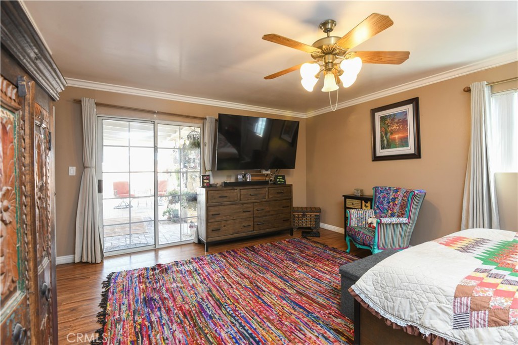 4616 North Roxburgh Avenue Covina, CA 91722 - Photo 13 of 23 a bedroom with a bed and wooden floor