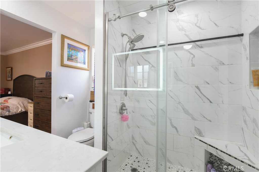 4616 North Roxburgh Avenue Covina, CA 91722 - Photo 14 of 23 a bathroom with a bathtub and shower