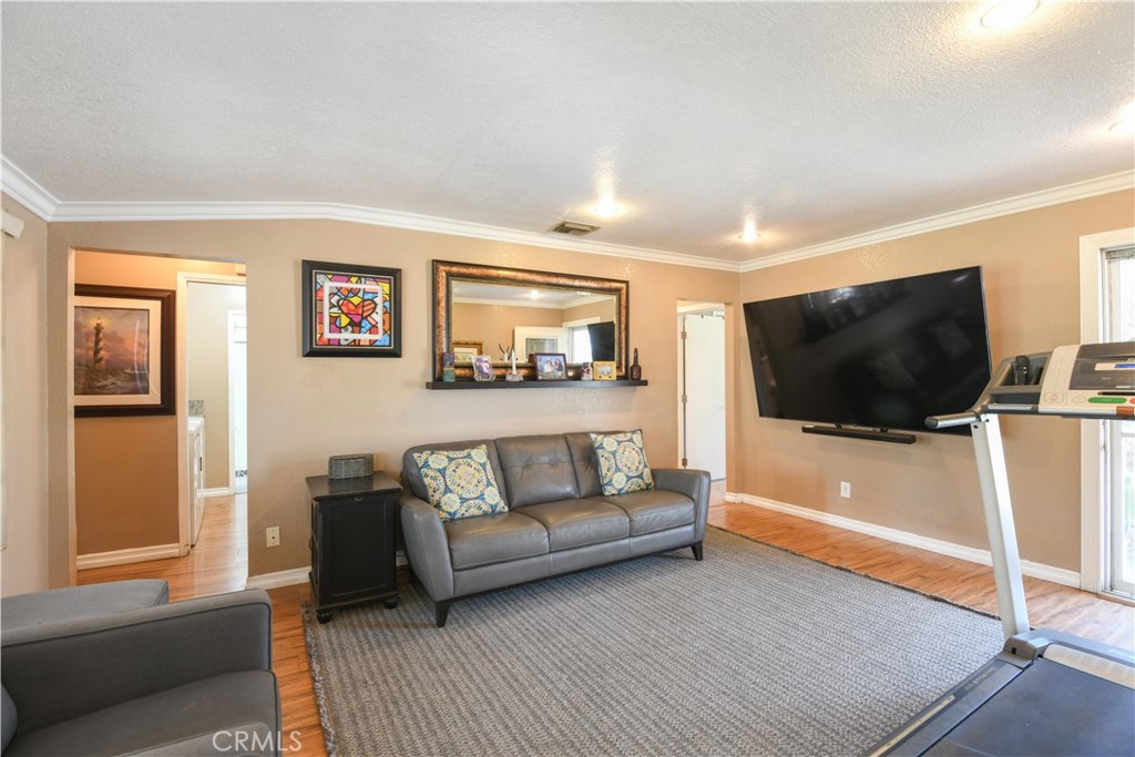 4616 North Roxburgh Avenue Covina, CA 91722 - Photo 3 of 23 a living room with furniture and a flat screen tv