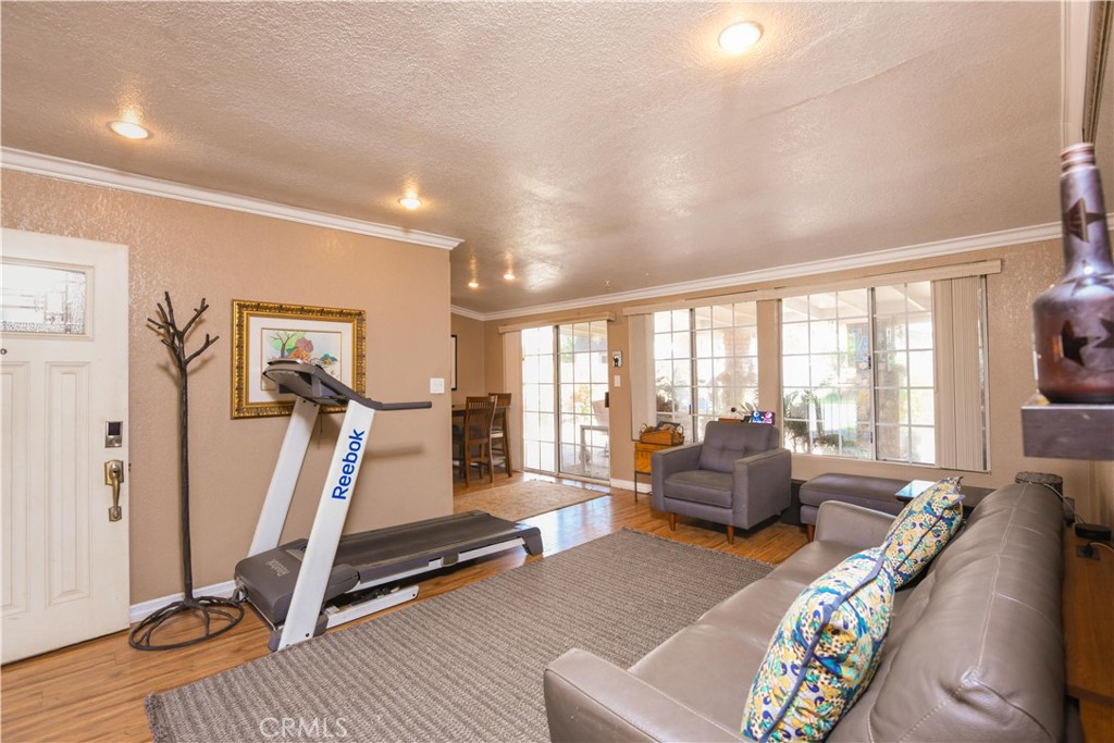 4616 North Roxburgh Avenue Covina, CA 91722 - Photo 4 of 23 a bedroom with furniture and a large window