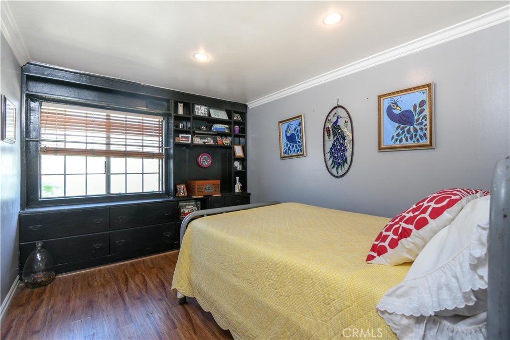4616 North Roxburgh Avenue Covina, CA 91722 - Photo 8 of 23 a bedroom with a bed and a dresser next to a window