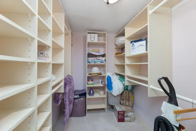 a kitchen with a sink appliances and cabinets