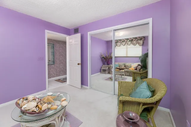 a living room with furniture and a chair