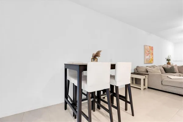 a view of a room with furniture and a window