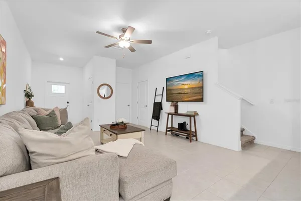 a living room with furniture and a flat screen tv