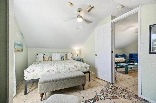 a bedroom with a bed and a table in it