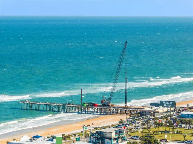 a view of a swimming pool with a lawn chairs