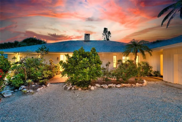 a view of a house with a street