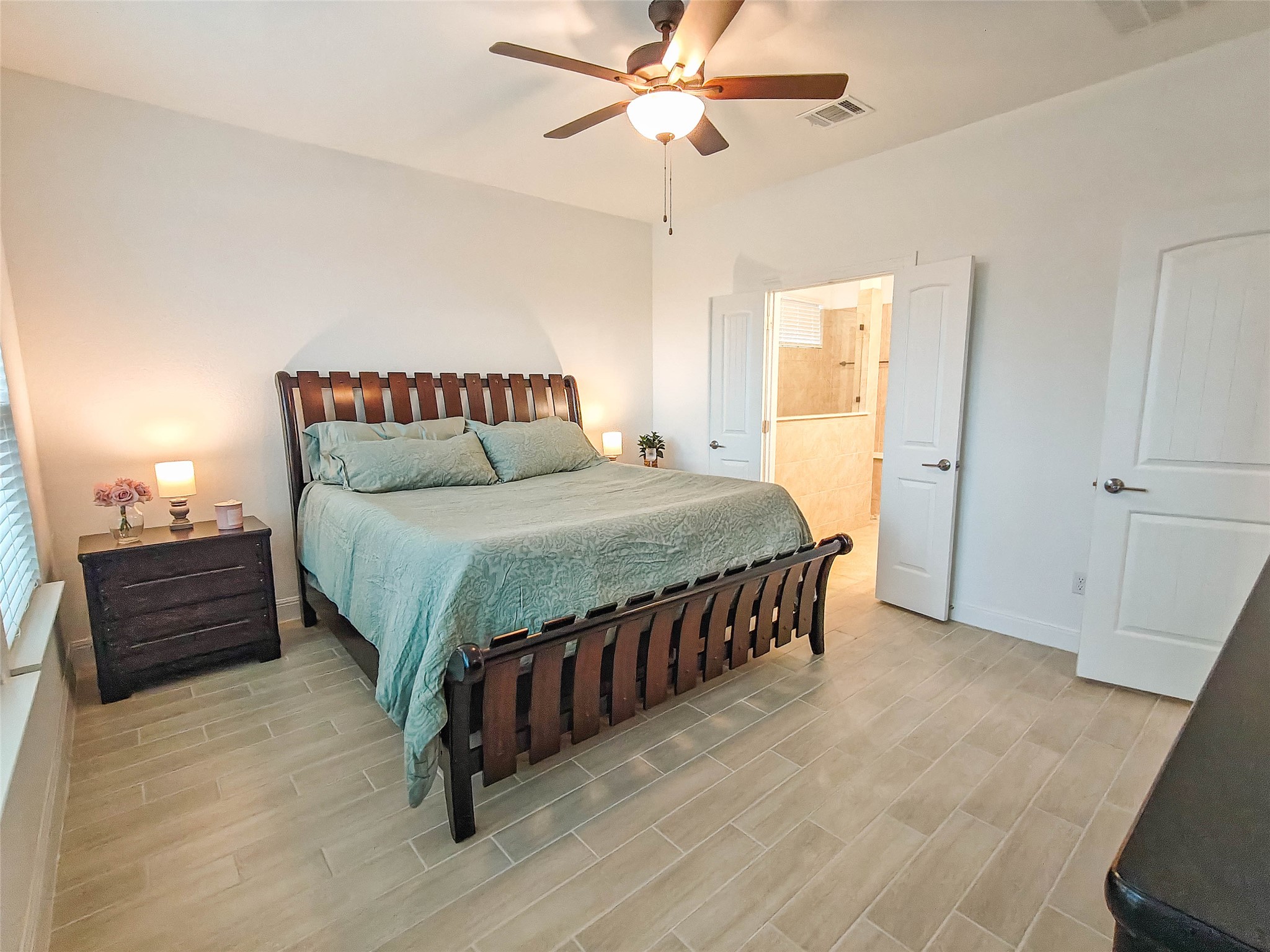 200 Fiddleneck Road Marble Falls, TX 78654 - Photo 13 of 37 a bedroom with a bed and wooden floor