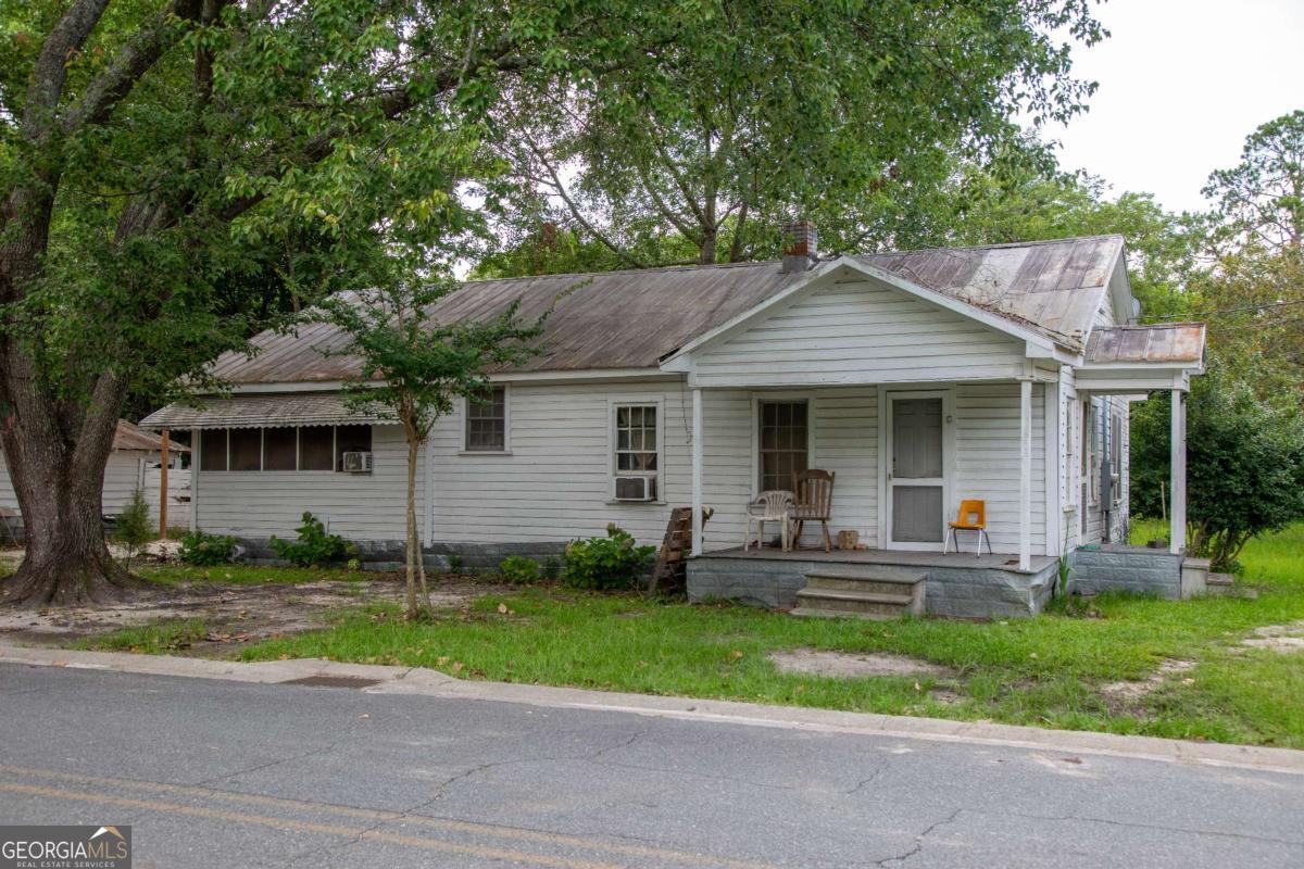 7 Burke Street Baxley, GA 31513 - Photo 1 of 1 a front view of a house with a yard and porch