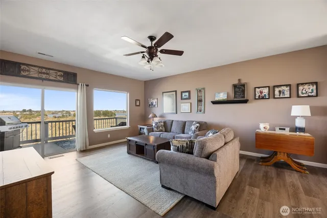 a living room with furniture and a large window