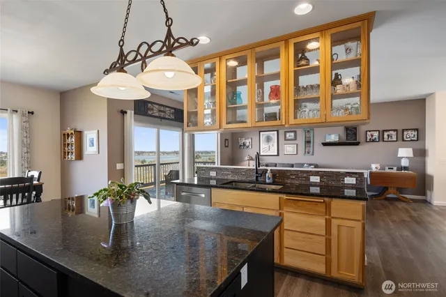 a kitchen with a counter a sink and cabinets