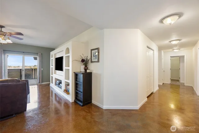 a view of a living room a refrigerator and a stove