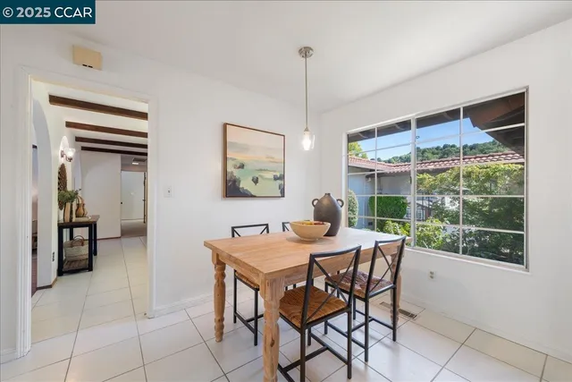 a view of a dining room with furniture window and outside view