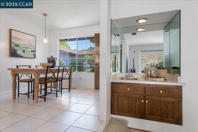 a bedroom with furniture and a potted plant