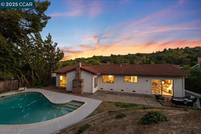 a view of a swimming pool with a patio