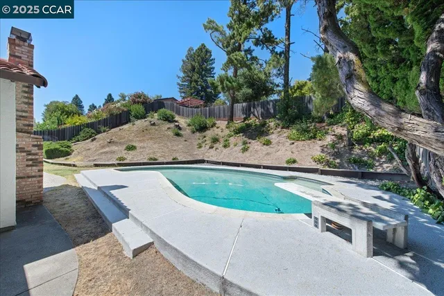 a view of a house with pool porch and sitting area