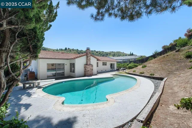 a view of a backyard with sitting area