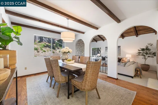 a view of a dining room with furniture window and outside view
